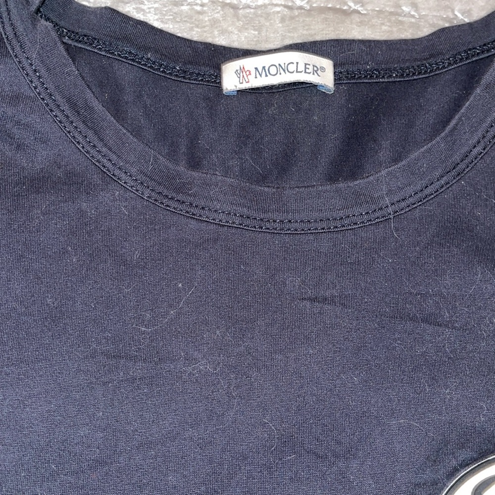 Preloved Moncler T-shirt great condition black 100% cotton size is M/L.